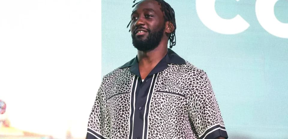 Man wearing patterned shirt at event stage