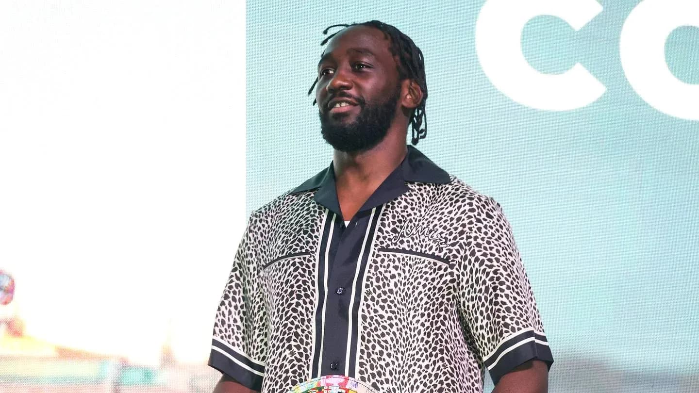 Man wearing patterned shirt at event stage