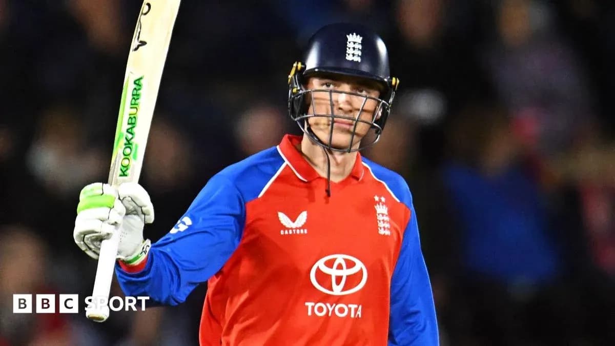 Batsman celebrating with bat during cricket match