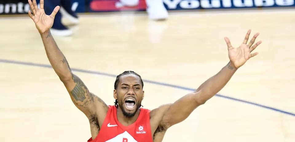Player celebrating with arms raised during game