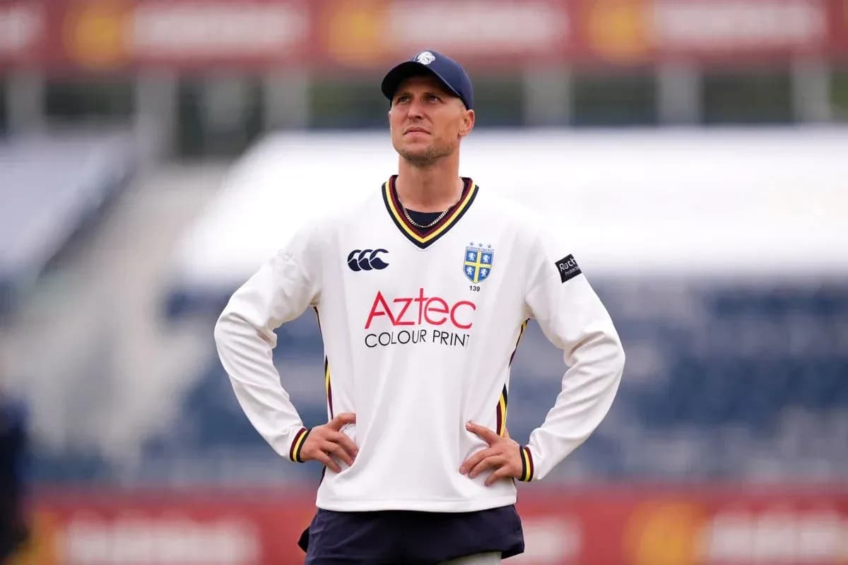Cricketer wearing team jersey on the field