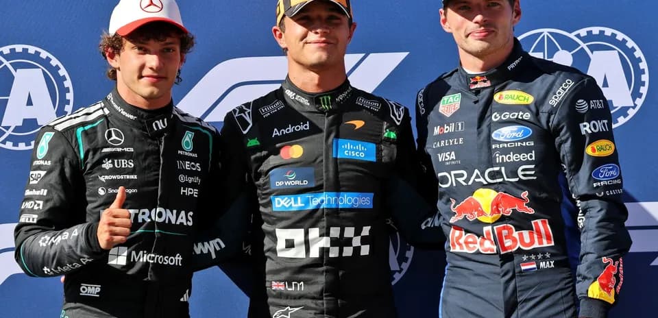 Three Formula 1 drivers posing after the race