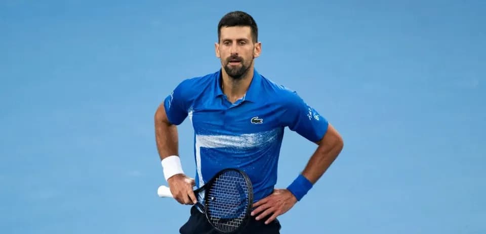 Tennis player in blue shirt during match