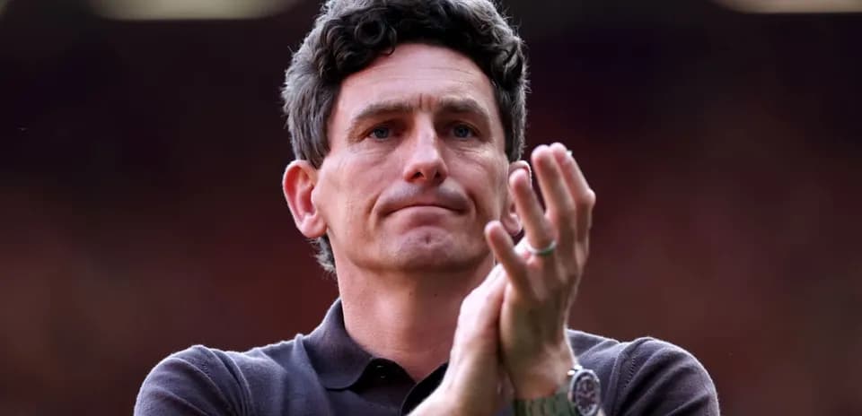 Man applauding in a sports venue