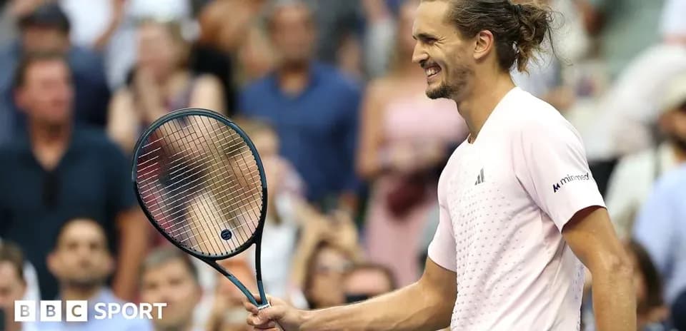 Tennis player celebrating with racket after match