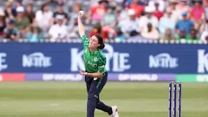 Bowler delivering a ball during cricket match
