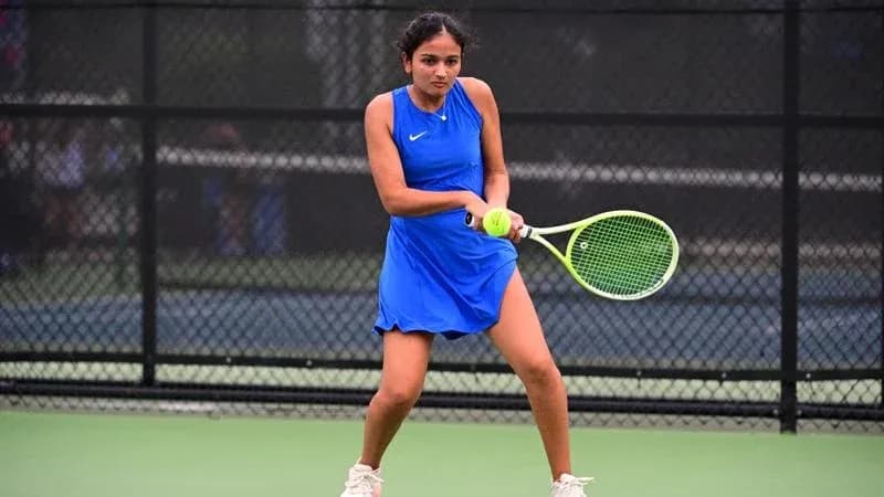 Female tennis player preparing to hit a serve