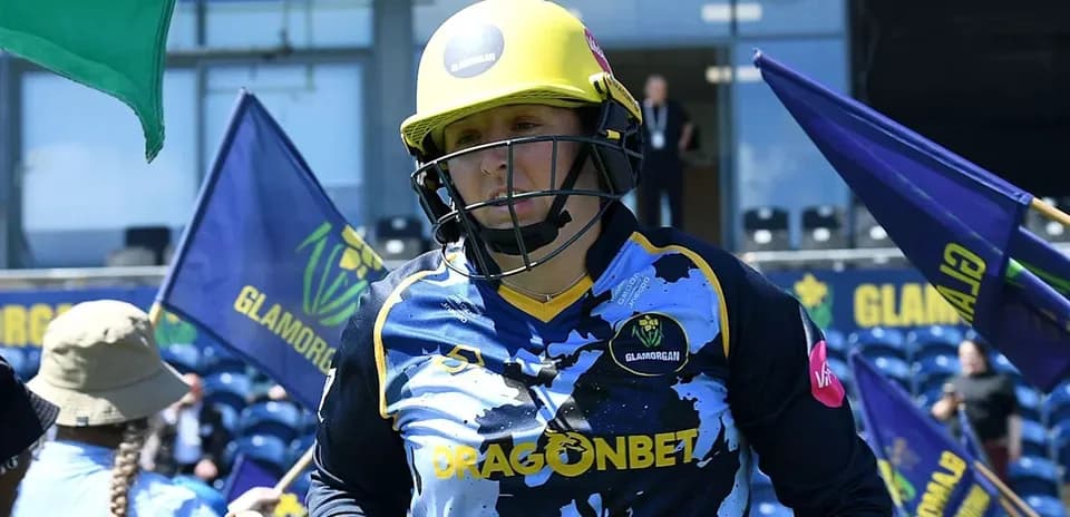 Player wearing helmet and Glamorgan kit entering the field