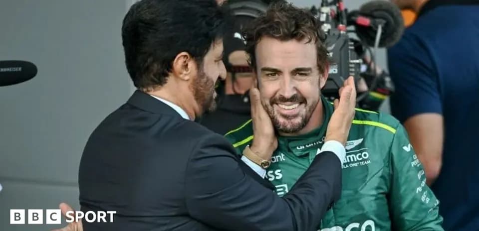 Fernando Alonso smiling with team principal after race