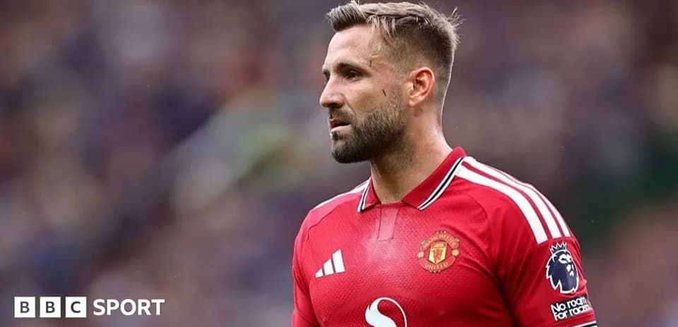 Player wearing Manchester United jersey on field