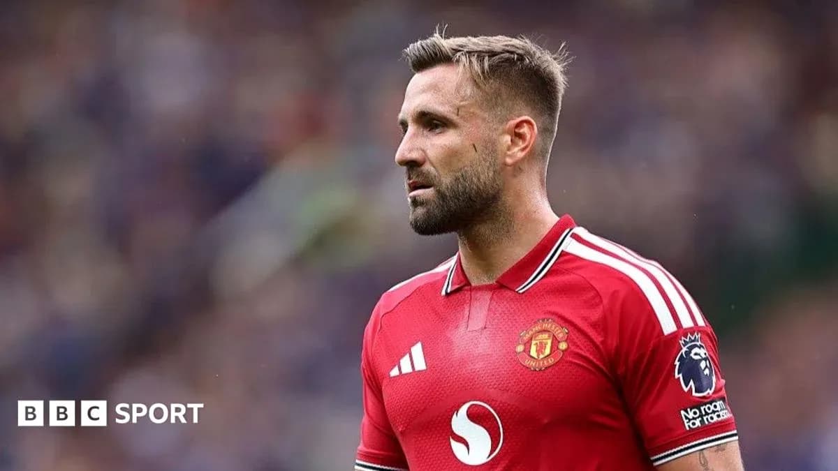 Player wearing Manchester United jersey on field