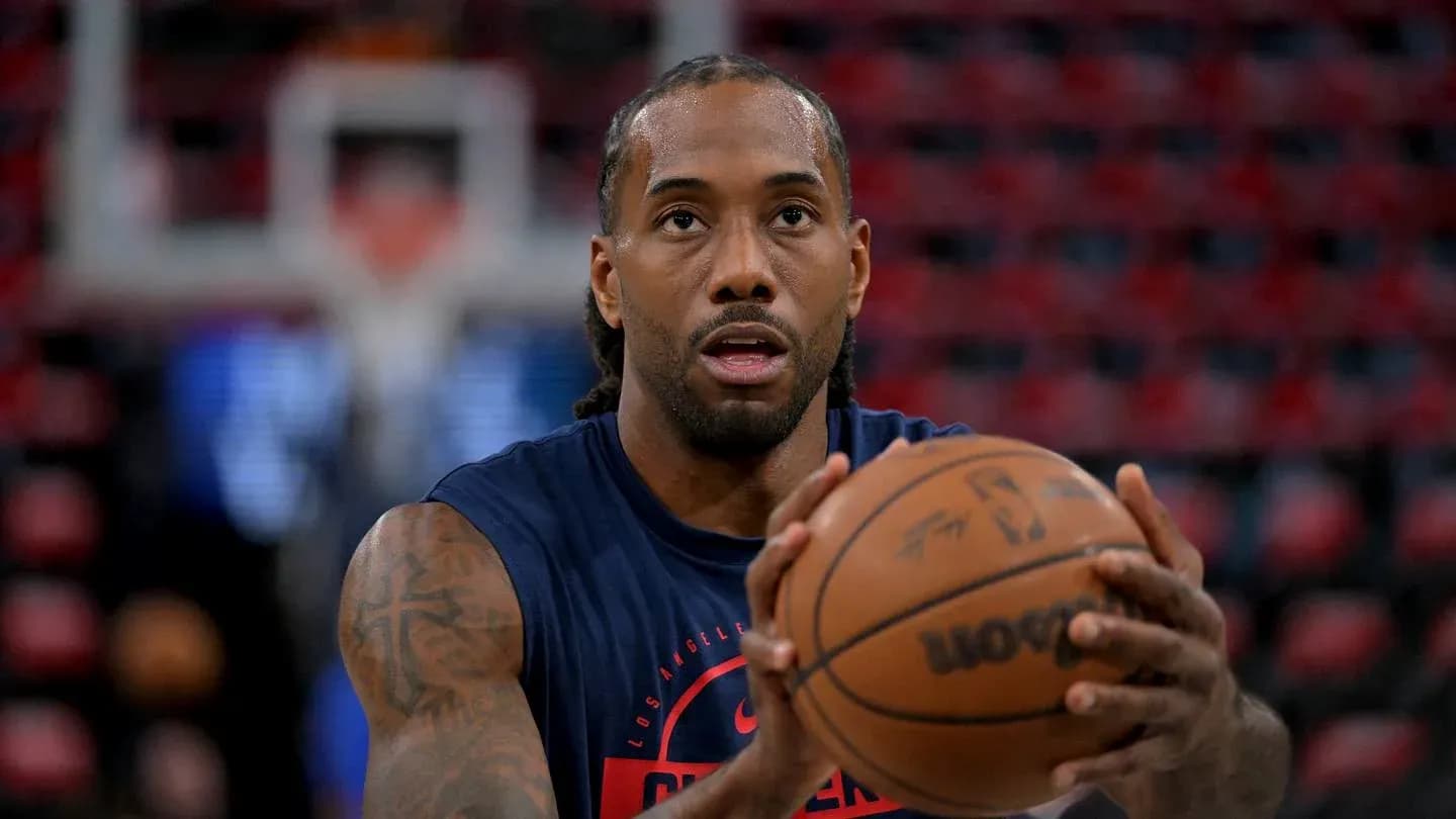 Player practicing shooting with basketball on court