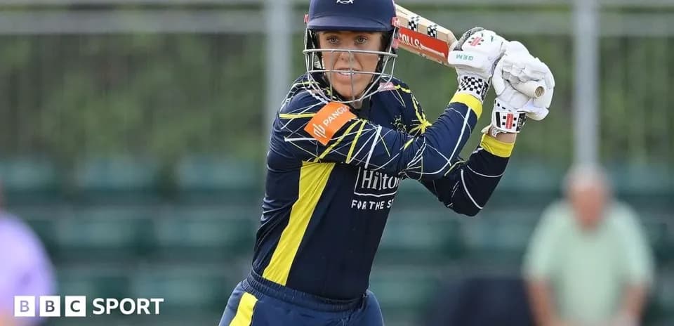 Batter preparing to hit the ball in cricket match