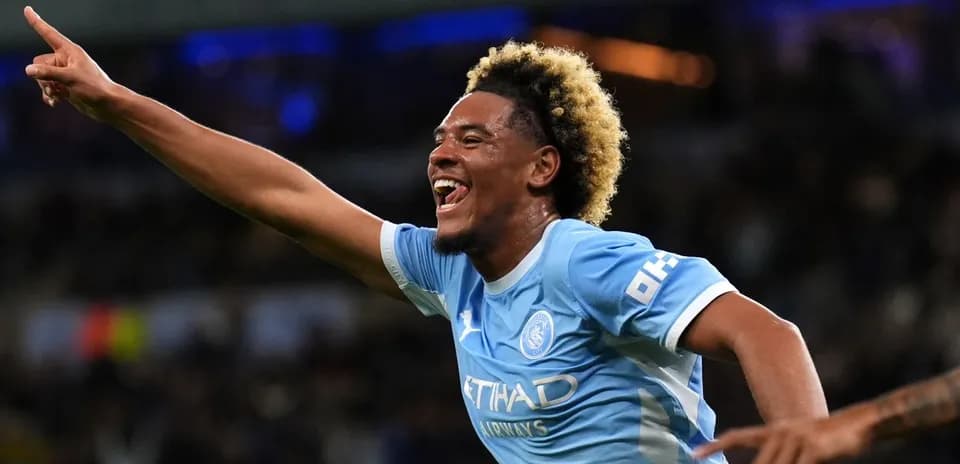 Player celebrating goal with raised hand during match