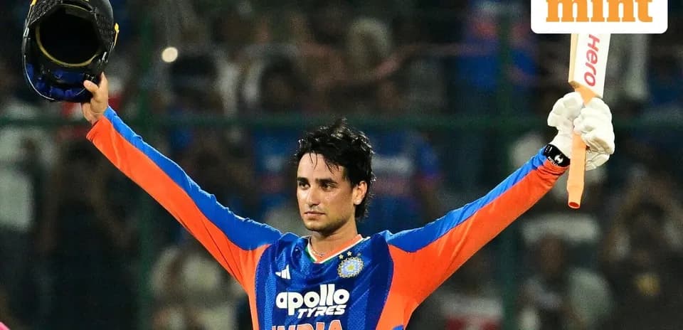 Cricketer celebrating a milestone with helmet and bat