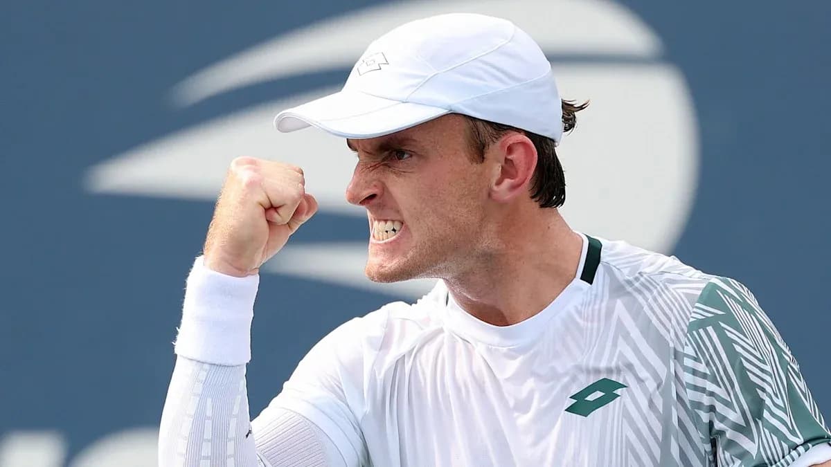 Tennis player celebrating a point with clenched fist
