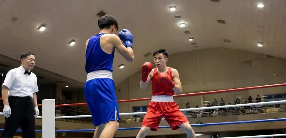 Two boxers competing in the ring during match