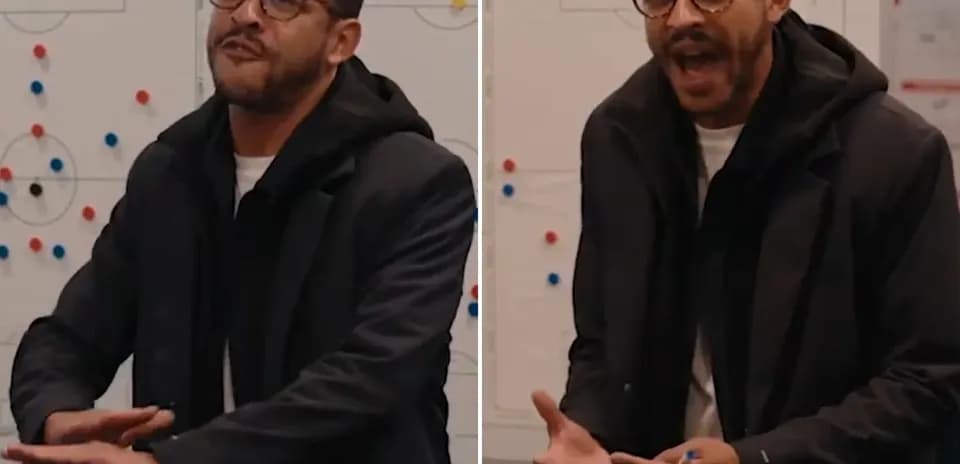 Coach discussing strategy in front of tactics board