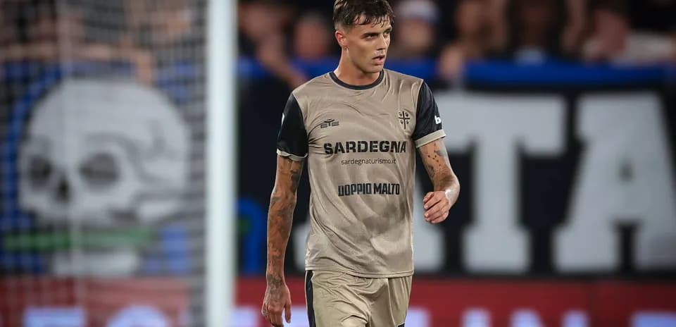Player walking on field during match wearing team kit