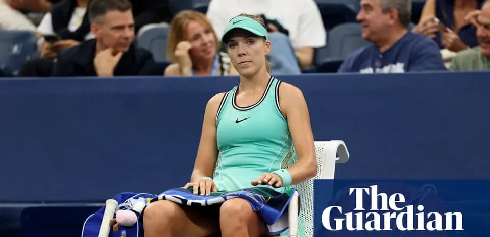 Player sitting on bench during tennis match
