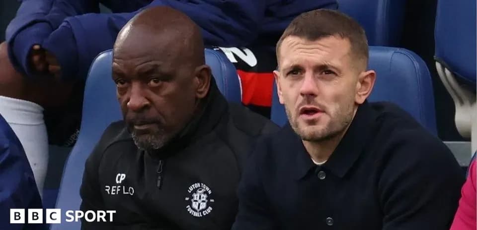 Luton Town staff sitting on the bench during match