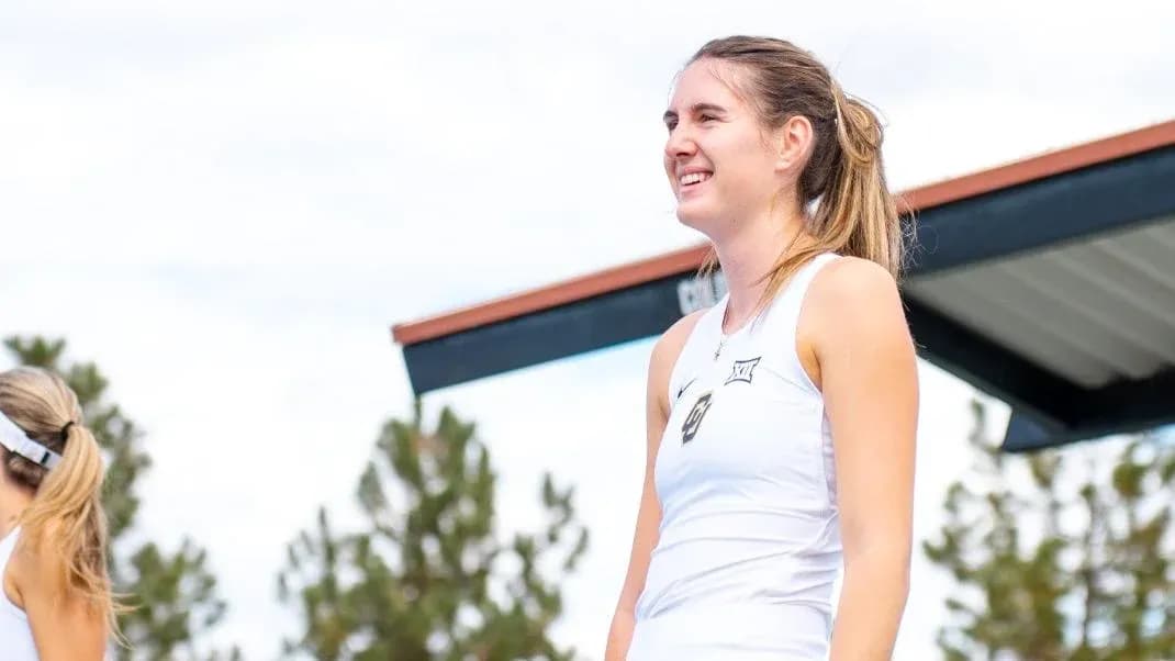 Tennis player smiling during outdoor event
