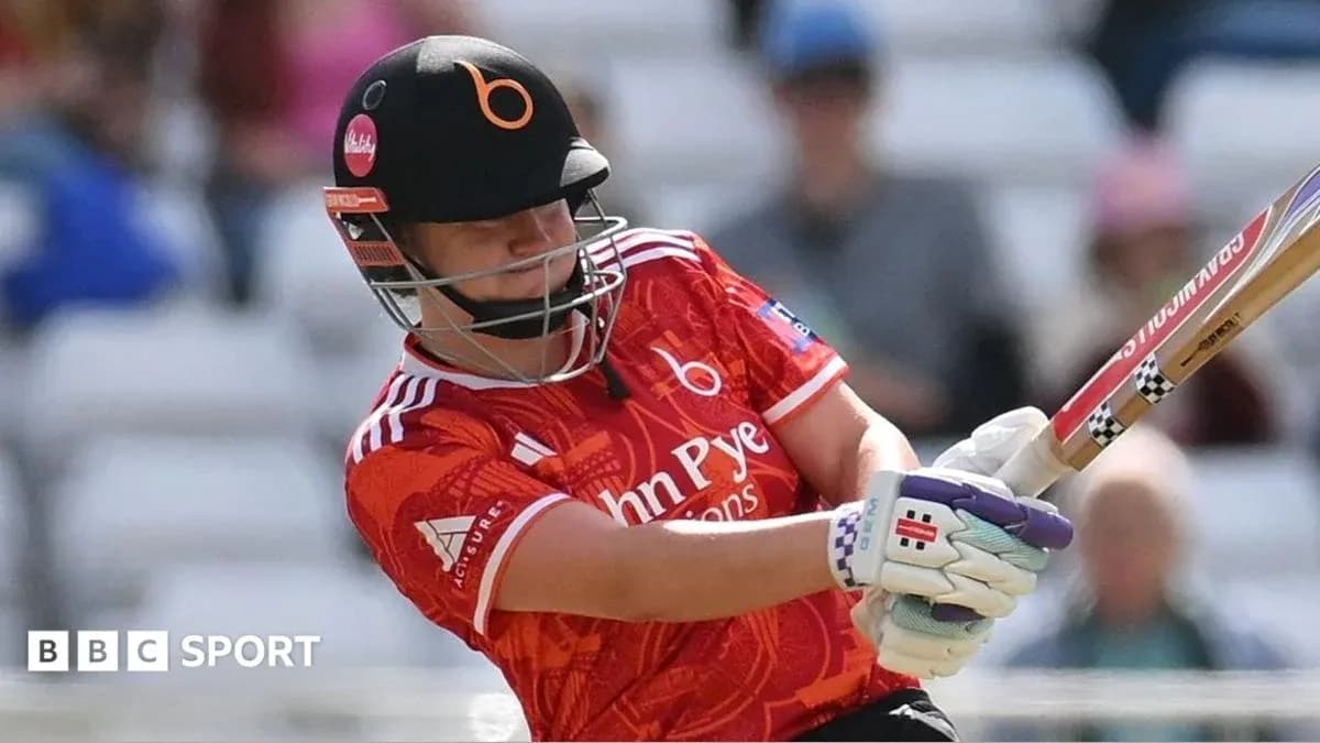 Batter striking the ball in a cricket match