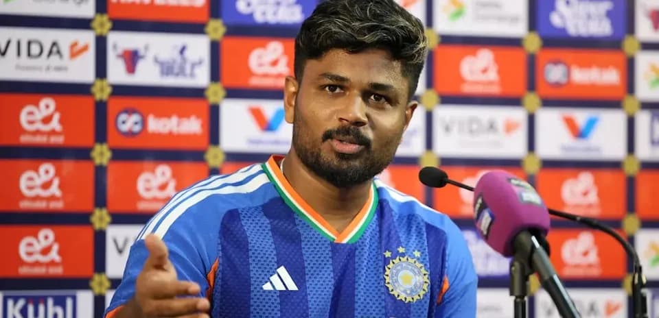 Player speaking at press conference with microphone