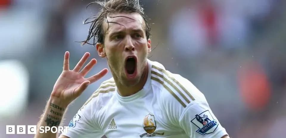 Player celebrating a goal with raised hand