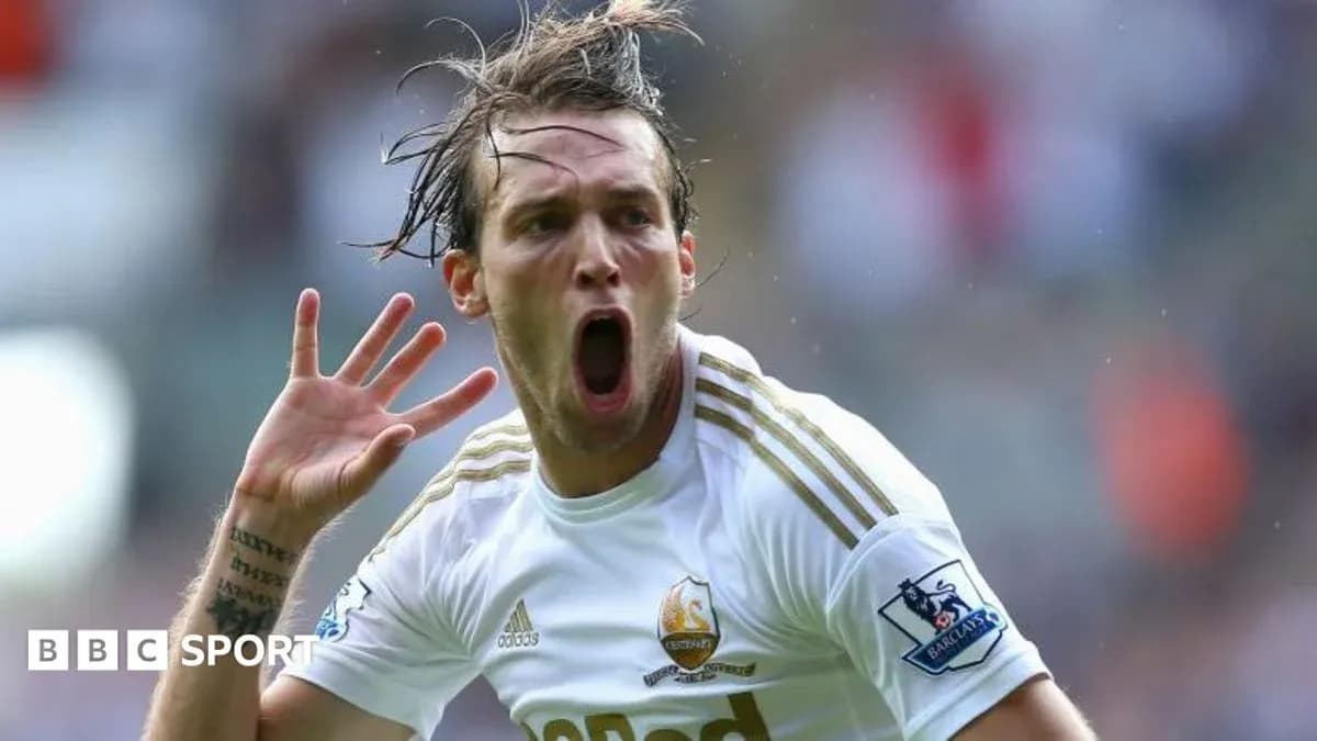 Player celebrating a goal with raised hand