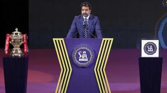 Speaker at IPL event with trophy and podium Speaker at IPL event with trophy and podium