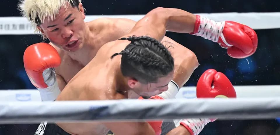 Boxers exchanging punches in the ring during match