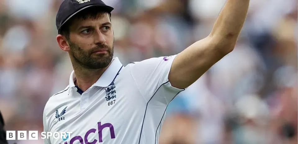 Cricketer gesturing to the crowd during match
