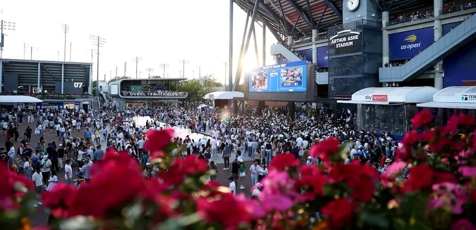 Crowd gathered outside Arthur Ashe Stadium at sunset