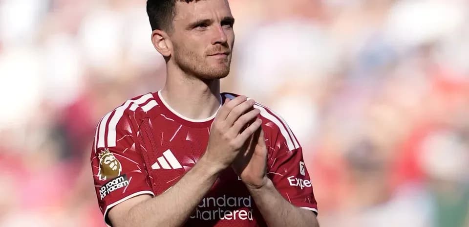 Player clapping in red jersey on field