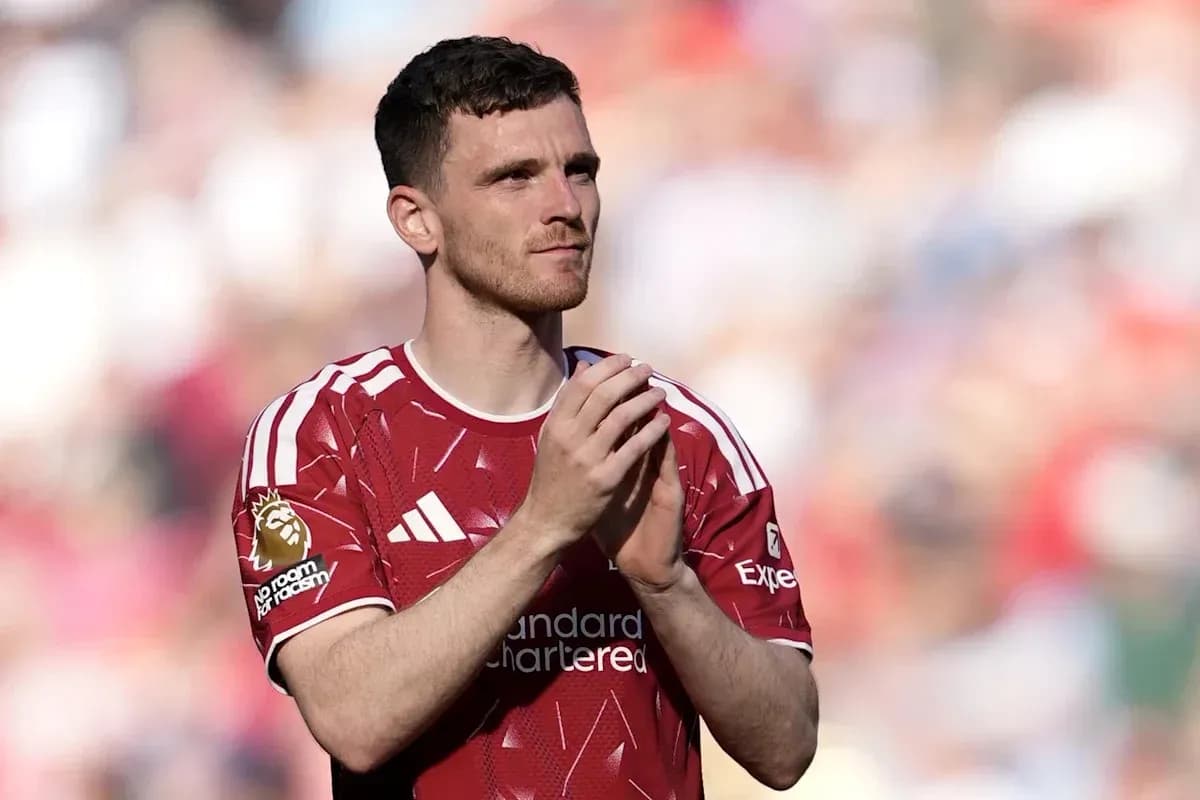 Player clapping in red jersey on field