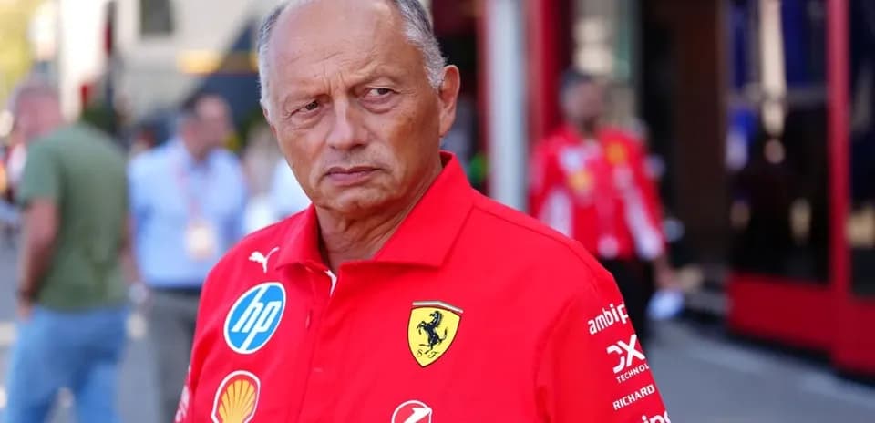Team principal in Ferrari uniform at pit area