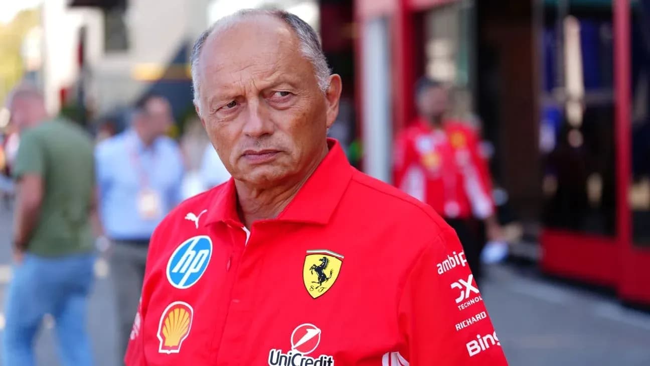 Team principal in Ferrari uniform at pit area