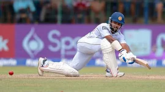 Batsman playing a shot during cricket match