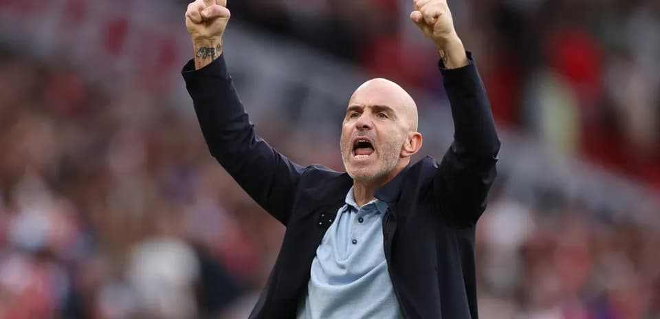 Coach celebrating passionately during a match