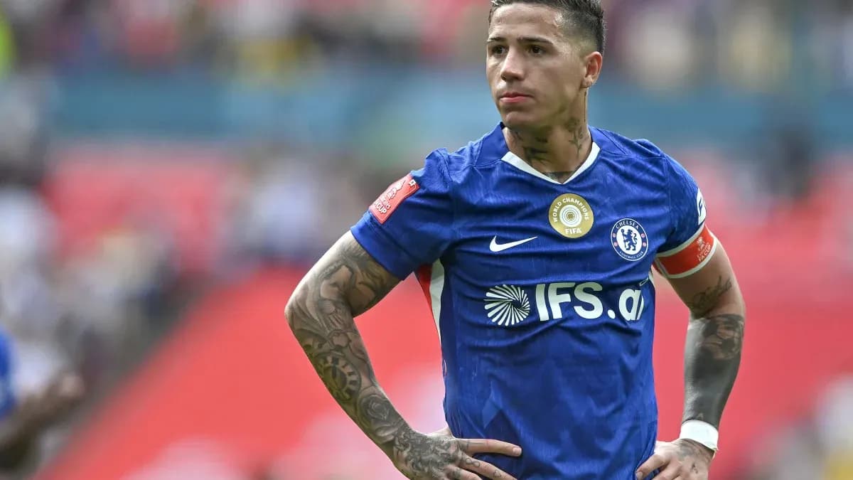 Player in blue jersey looking focused on field