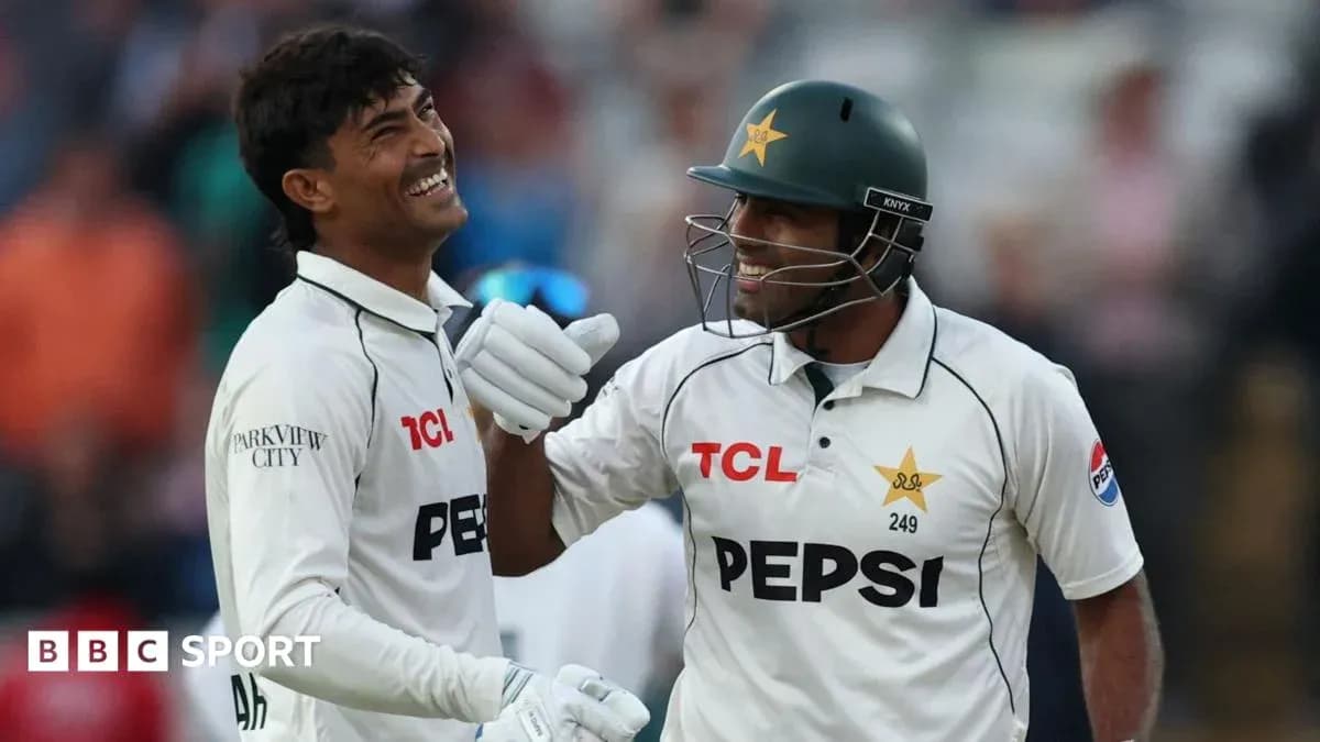 Two cricketers celebrating on the field