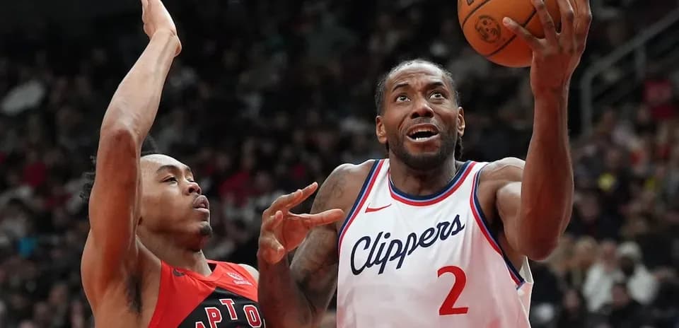 Player shooting during basketball game between Clippers and Raptors
