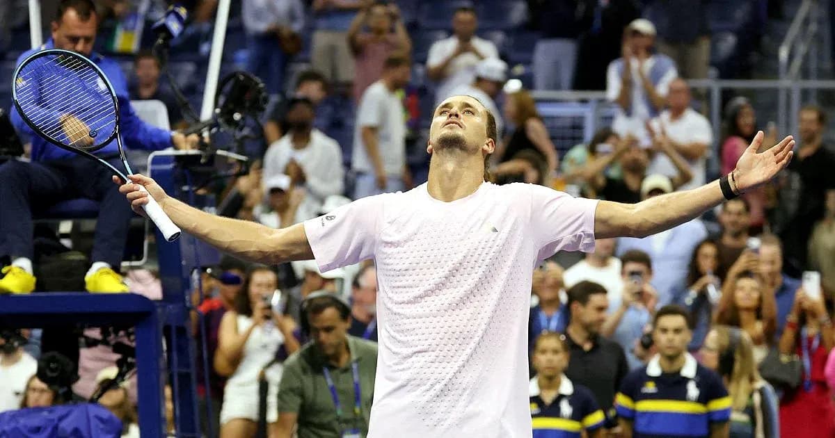 Player celebrating with arms raised after match