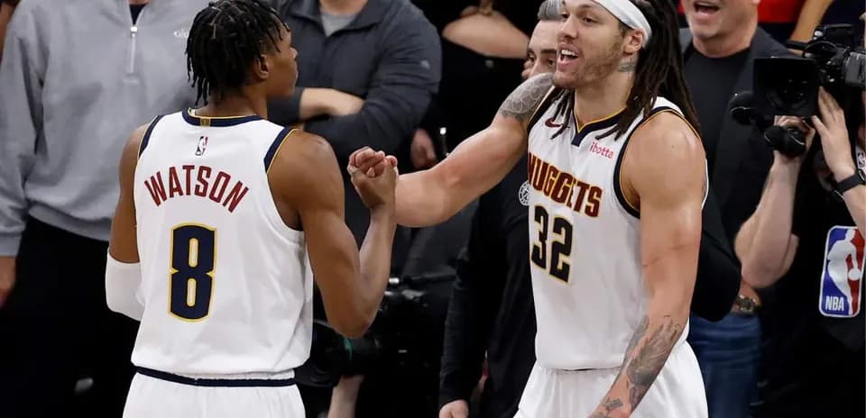 Two players celebrating during a basketball game