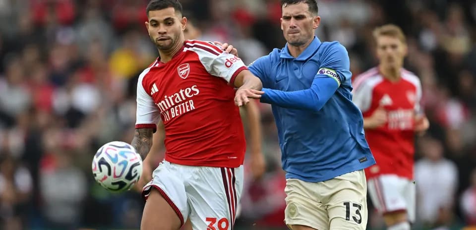 Two players contesting the ball during a match