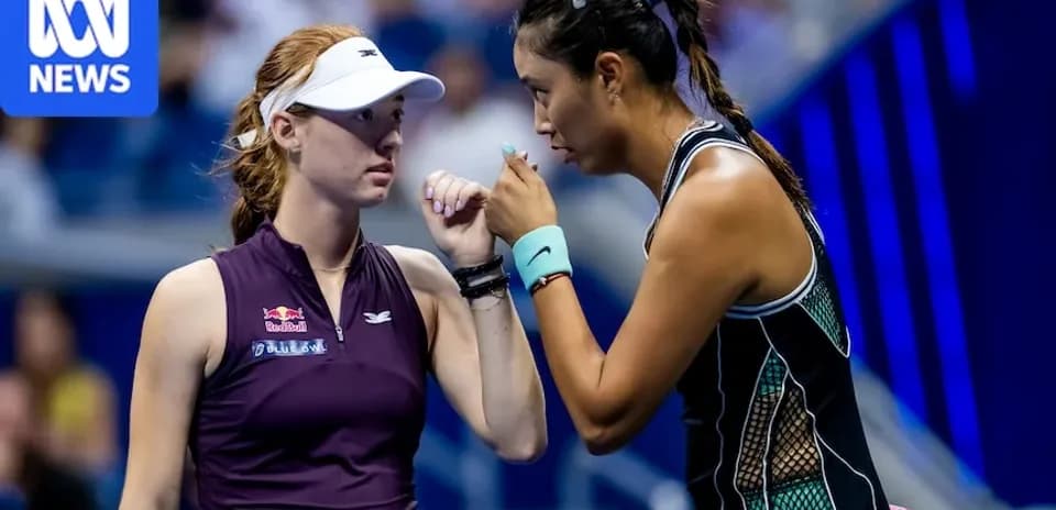Two female tennis players discussing strategy during match