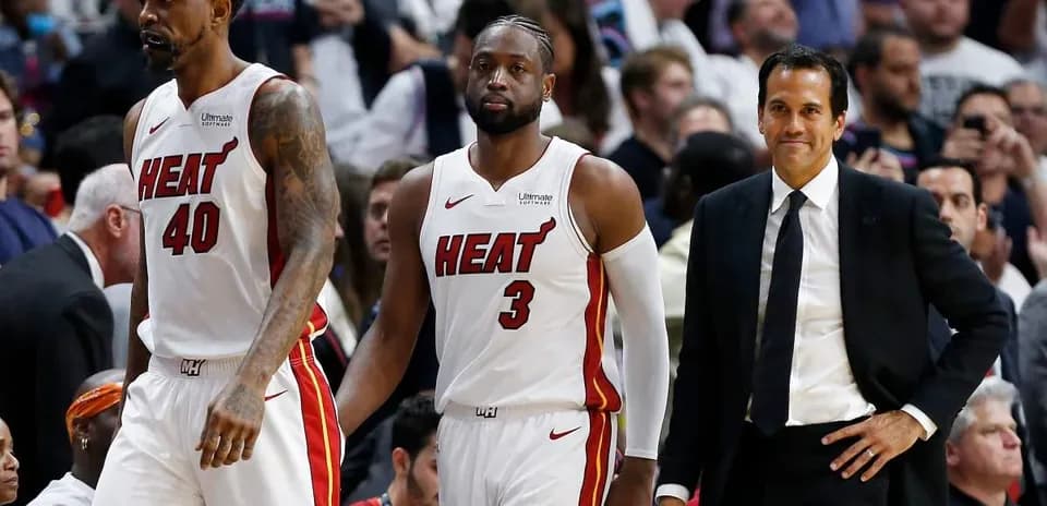 Miami Heat players and coach during game moment