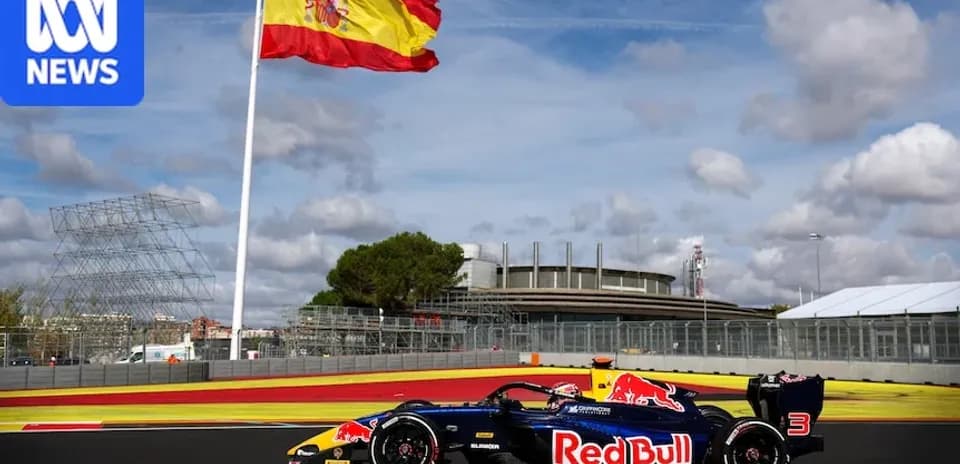 Red Bull racing car on track with Spanish flag