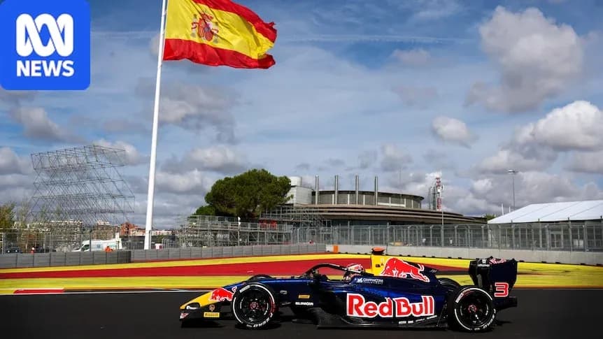Red Bull racing car on track with Spanish flag